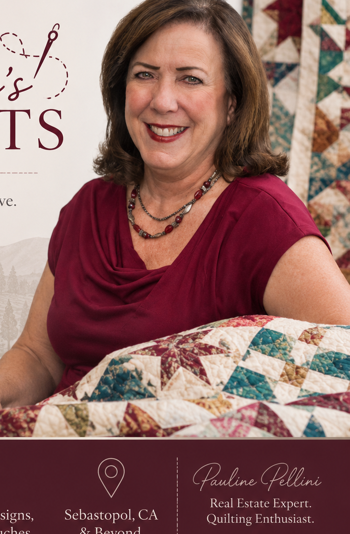 Pauline Pellini, founder of Pauline's Quilts, holding a handcrafted star-pattern quilt in her Sebastopol studio